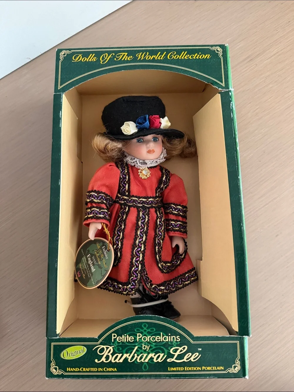 Petite Porcelain Doll in Red Dress and Black Hat
